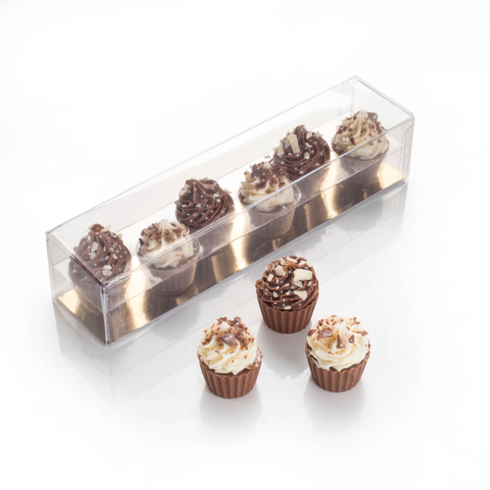 Mini Chocolate Cupcakes topped with a vanilla or milk chocolate swirl, decorated with chocolate sprinkles.